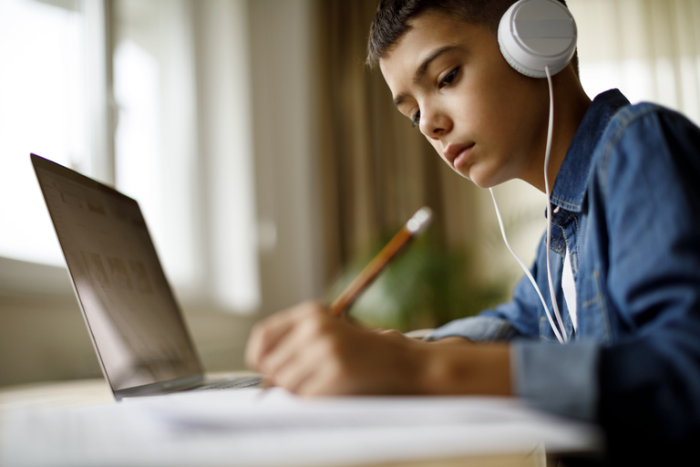 Male student receiving online lessons